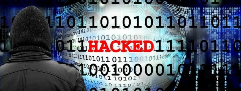 Graphic shows a hooded person with the word "Hacked" surrounded by digital coding.