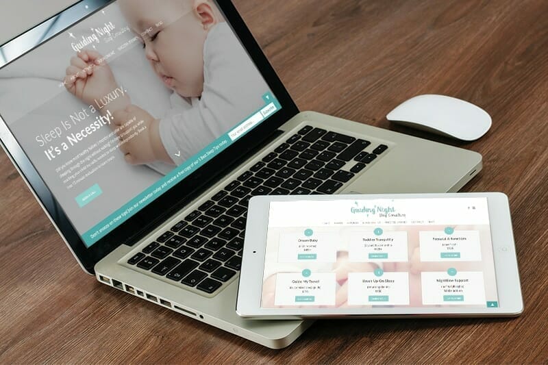 Guiding Night website displayed on a laptop and a tablet.