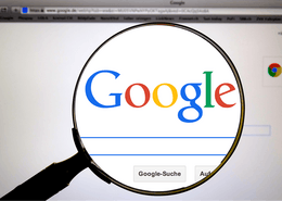 A magnifying glass over the word Google that is displayed on Google's search page.