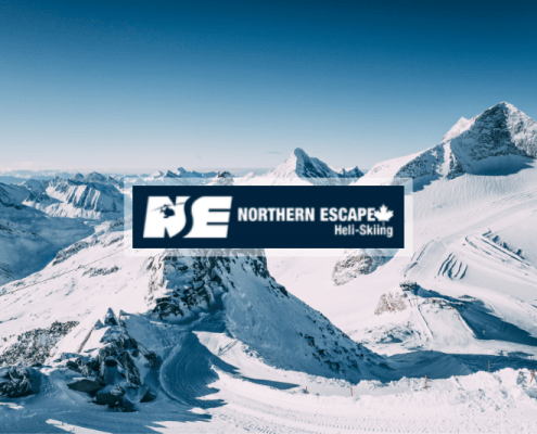 Northern Escape Heli-Skiing featured image of snow covered mountains.