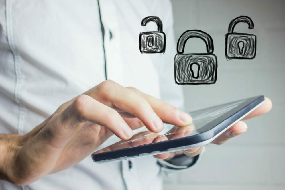 Man holding cell phone with unlock-lock-unlock draw over it