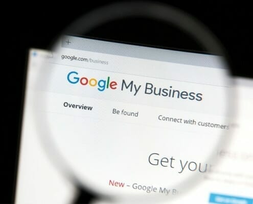 Magnifying Glass highlight Google My Business on a computer screen