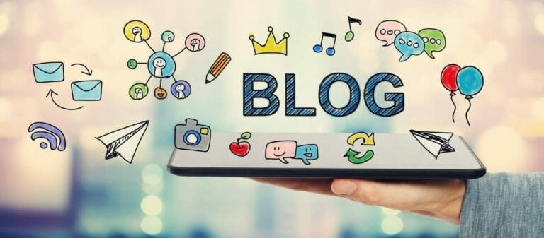 Hand (palm up) holding a tablet with colourful drawings and the word BLOG written around it