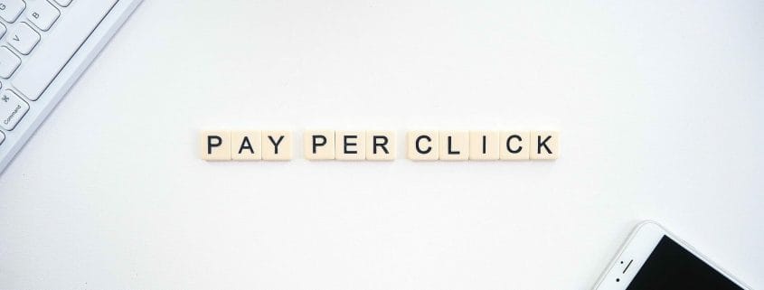 Pay Per Click spelled out using Scrabble pieces