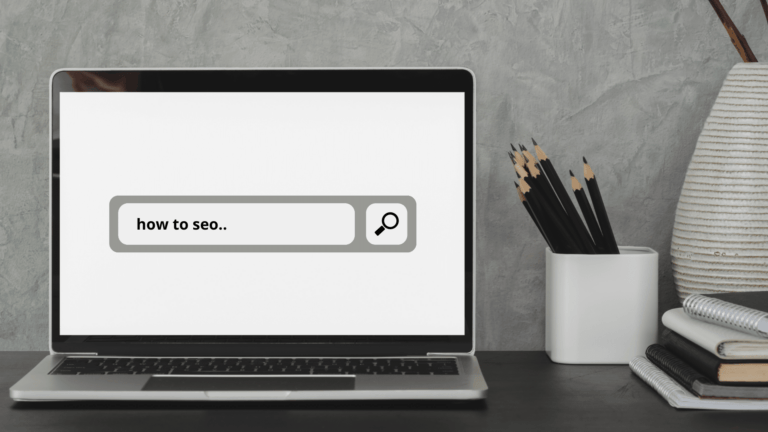 Laptop computer with "how to SEO" on the screen