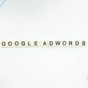 Google Adwords spelled out with Scrabble Letters - next to smart phone