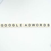 Google Adwords spelled out with Scrabble Letters - next to smart phone