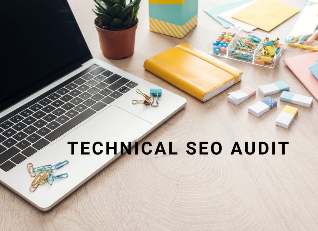 technical seo audit words over laptop and notepads