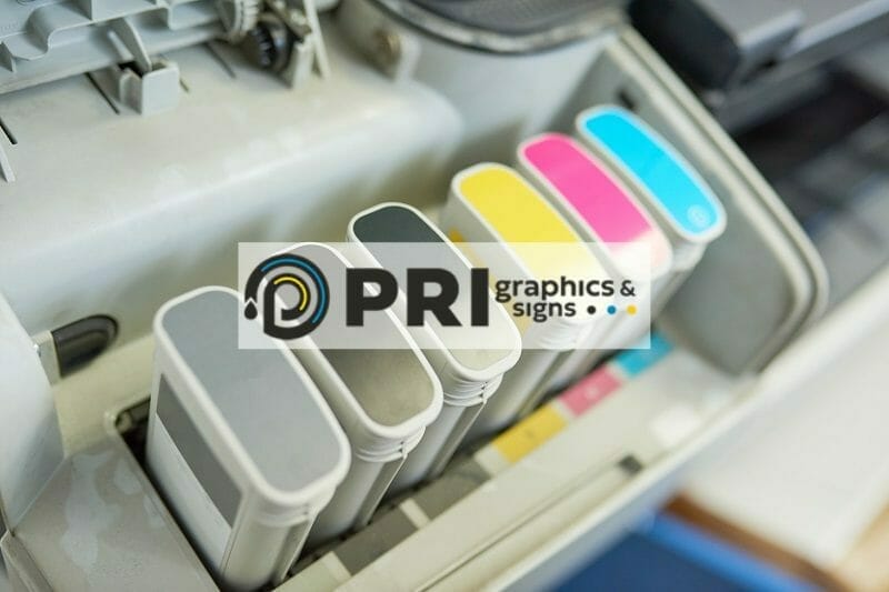 PRI Graphics logo over image of commercial color printer