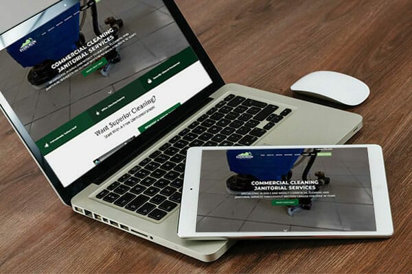Evergreen Maintenance web page displayed on laptop and tablet