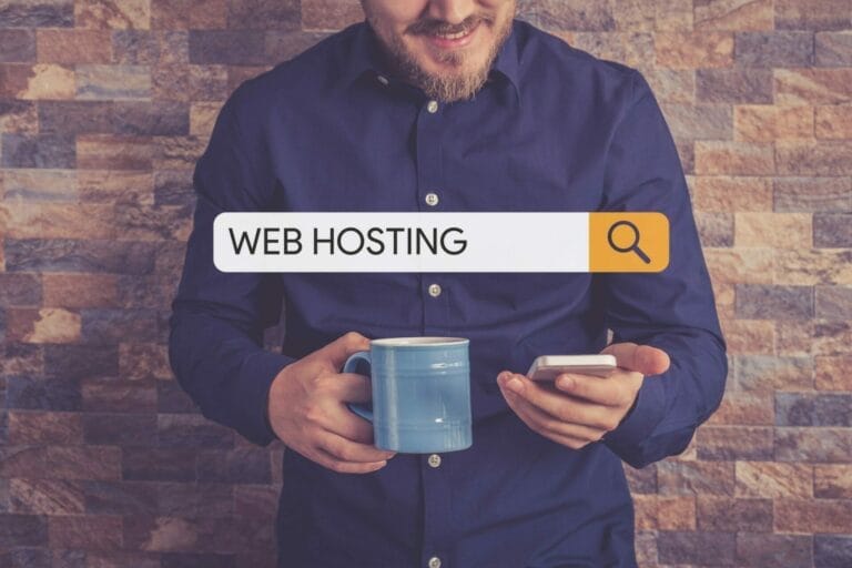 guy holding phone searching for web hosting