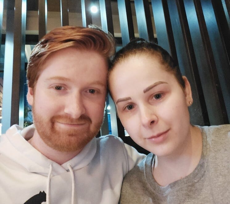 Keiran Griffiths posing with his wife