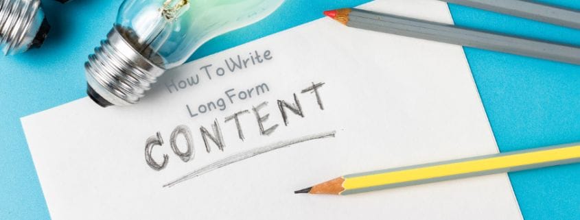 Light bulbs, pencils, and a sheet of paper that reads "How to Write Long Form Content."