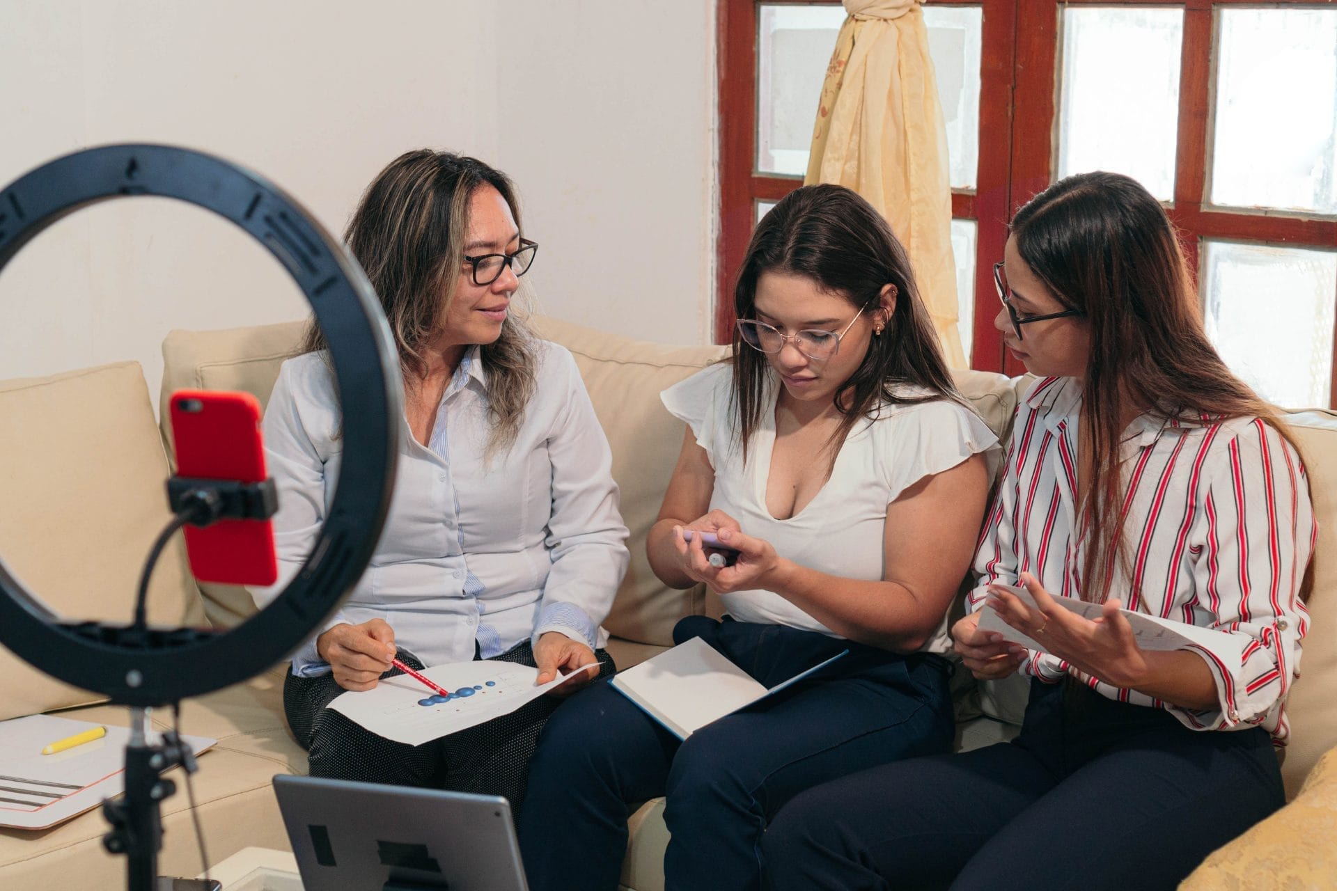 video seo featured image of three women filming video footage
