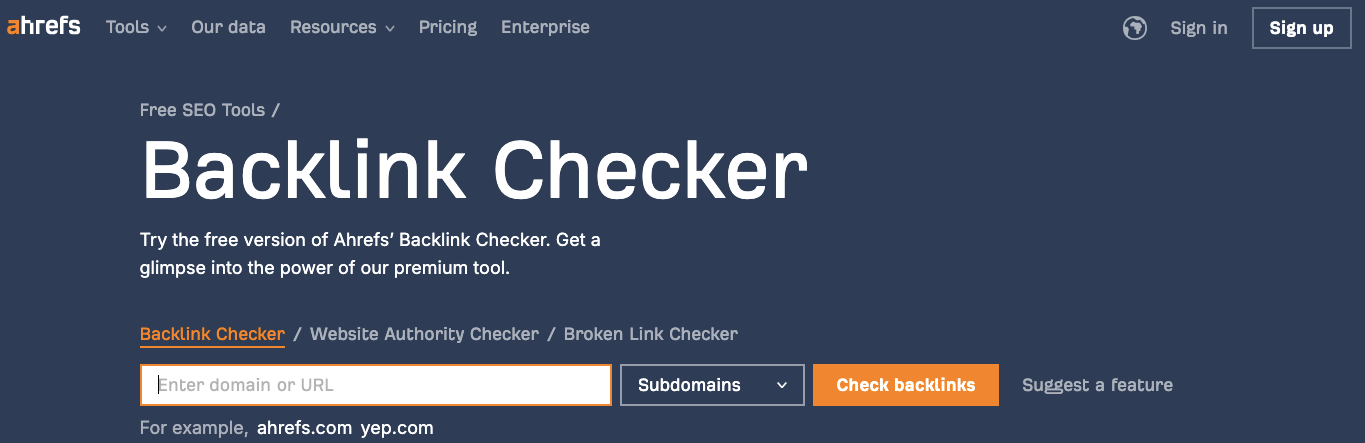 Screenshot of Ahrefs' Backlink Checker webpage. Features include a text box for entering a domain or URL, a button to check backlinks, and options for subdomains. It also mentions free SEO tools and a premium tool offer. Sign in and sign up options are visible.