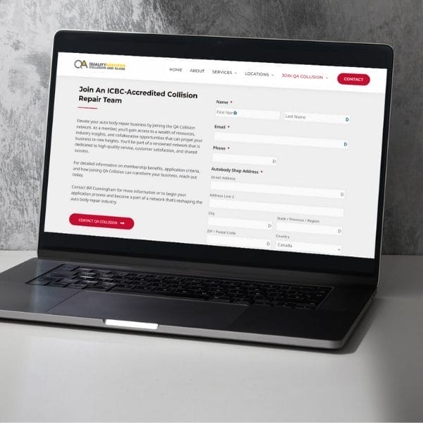 A laptop displaying a webpage titled “Join An ICBC-Accredited Collision Repair Team,” featuring a form to enter personal details like first name, last name, email, phone number, and shop address. A gray wall serves as the backdrop.