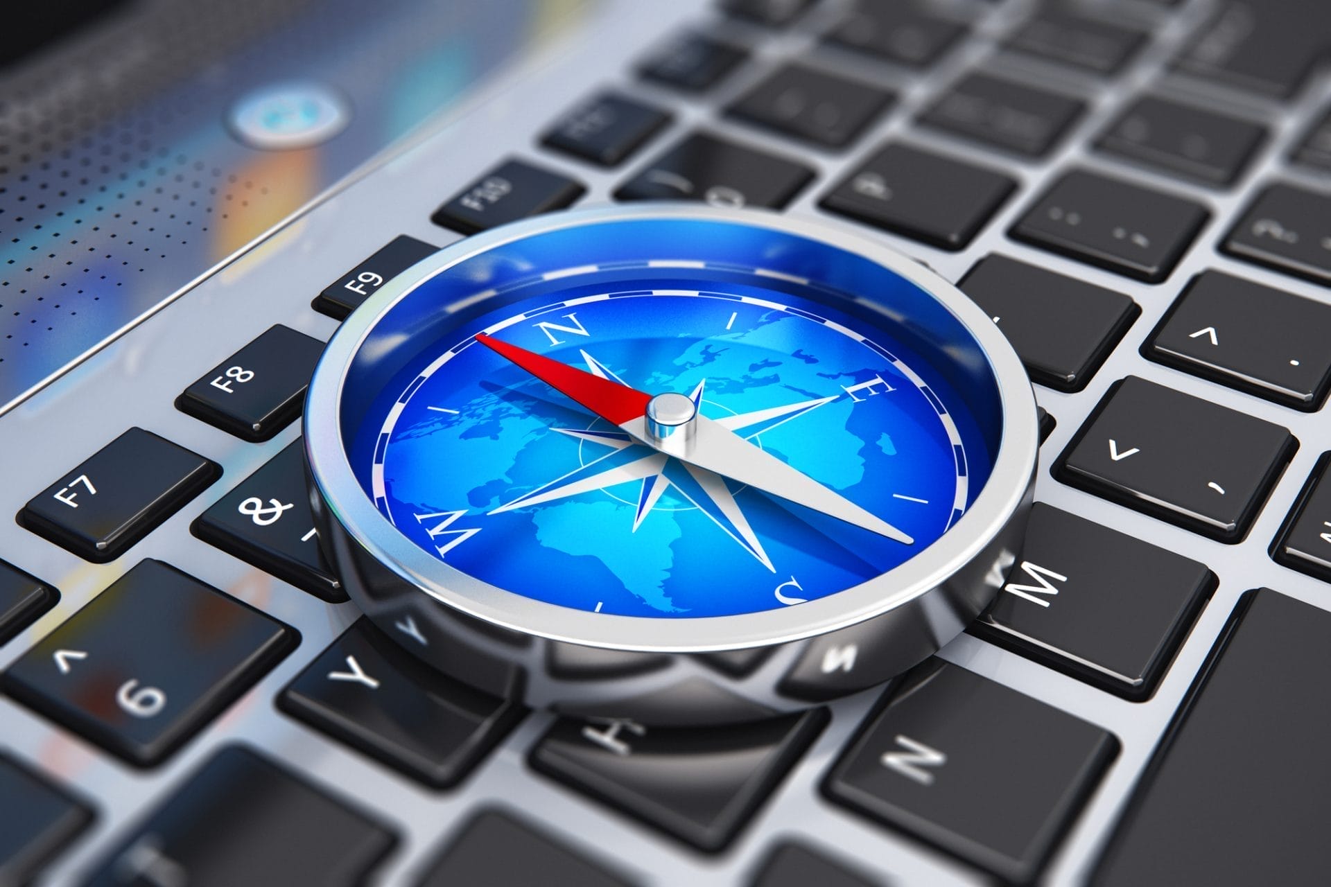 compass on top of laptop
