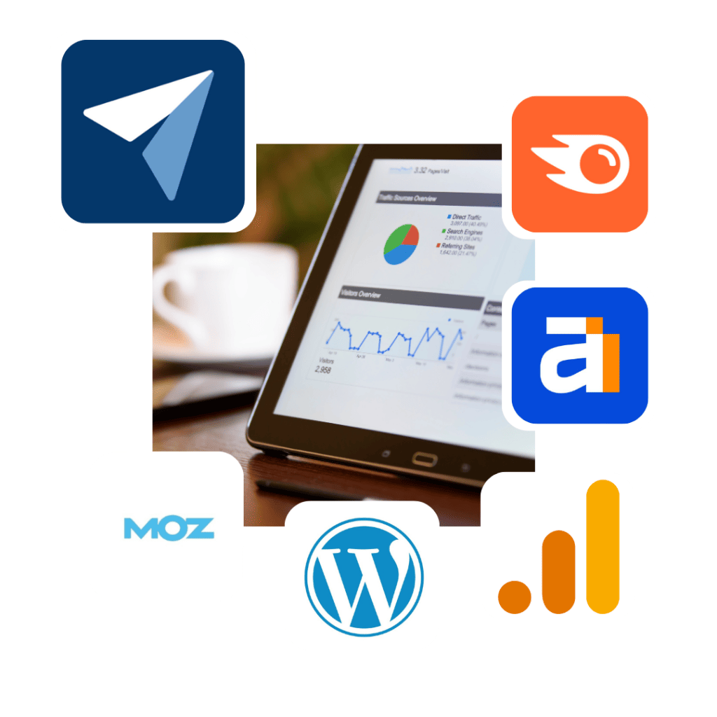 A tablet displaying analytics graphs is surrounded by logos: a paper airplane, an orange square with a circular arrow, a blue "a," "Moz," the WordPress symbol, and a bar chart icon. A coffee cup is blurred in the background.