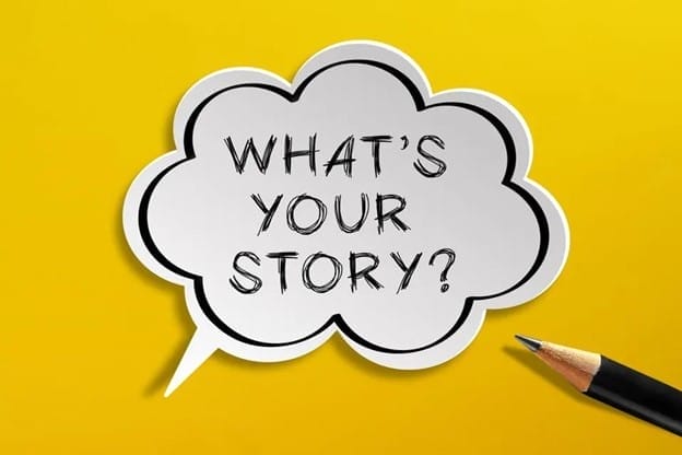 A speech bubble with the text "WHAT'S YOUR STORY?" is on a bright yellow background. A sharpened pencil points towards the bubble from the bottom right corner, suggesting a call to share or create a story.