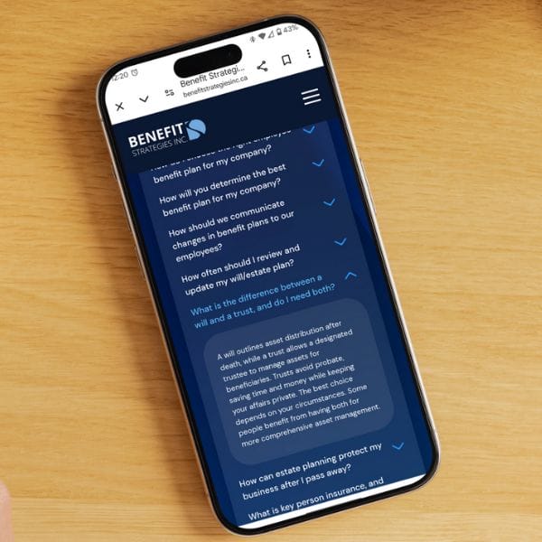 A smartphone displaying a webpage from Benefit Strategies Inc. on a wooden surface. The screen shows a list of FAQs about company benefit plans, estate planning, and insurance, along with navigational menu icons.